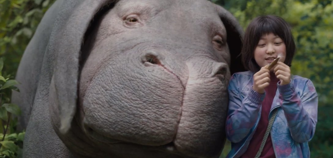 Okja creature with young girl