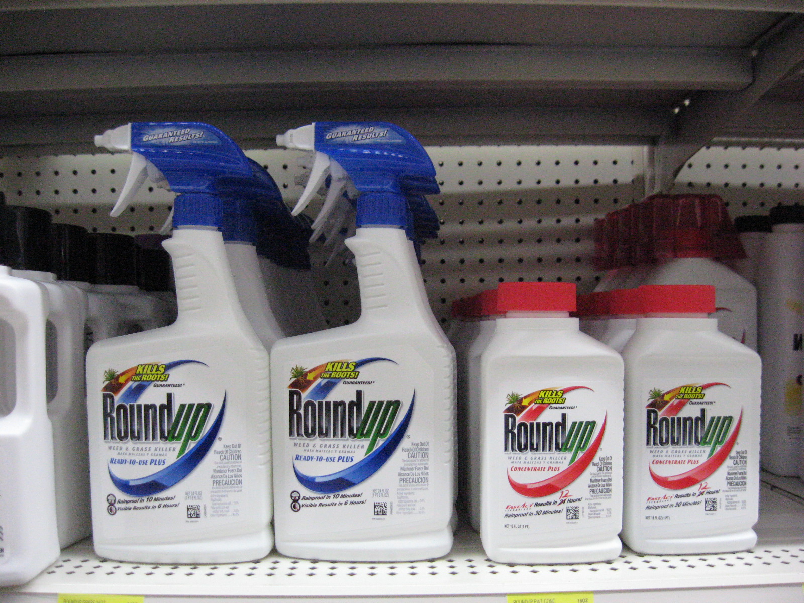 Roundup spray bottles on shelf