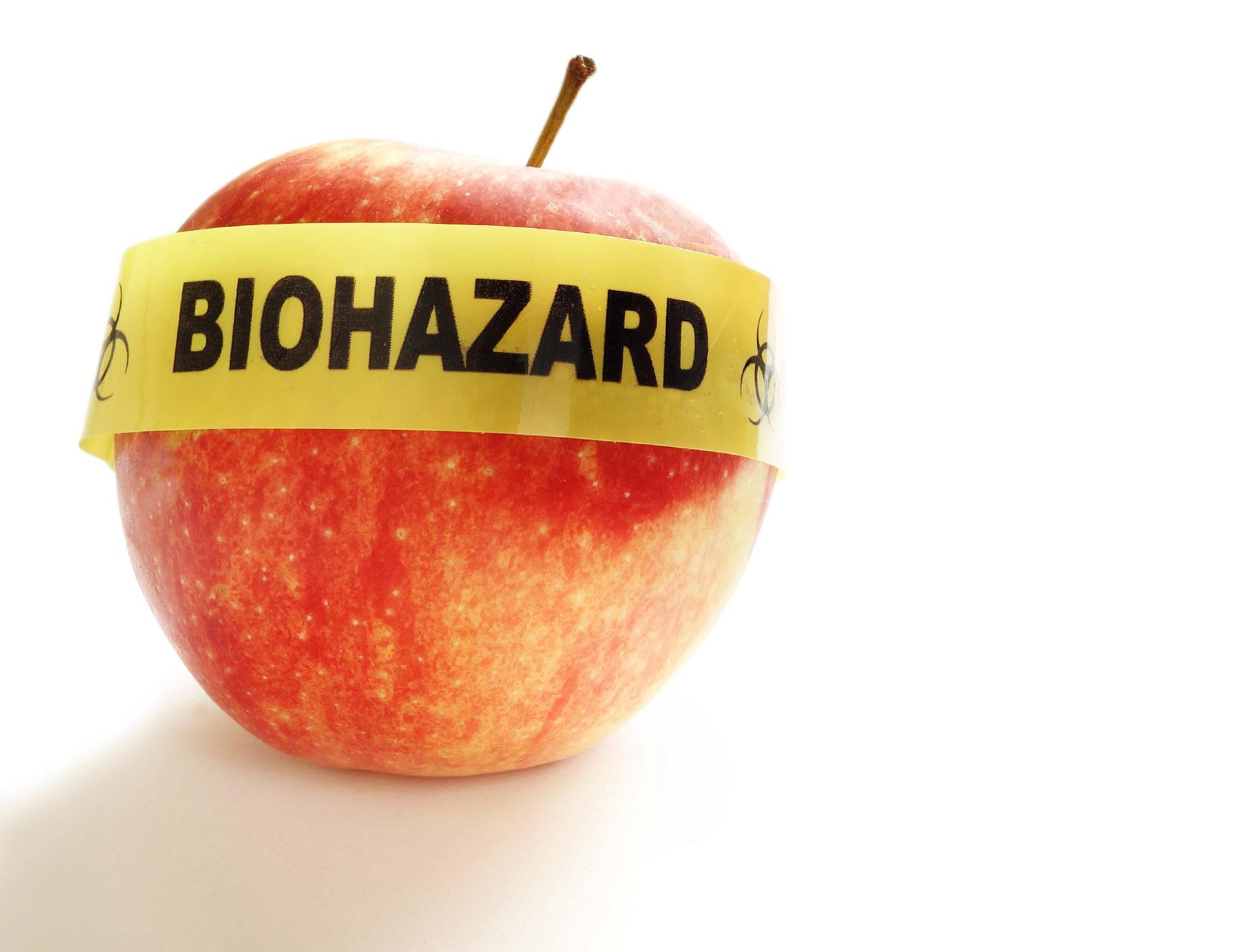 Red apple with yellow Biohazard tape