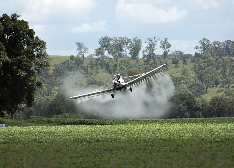 Crop duster over field