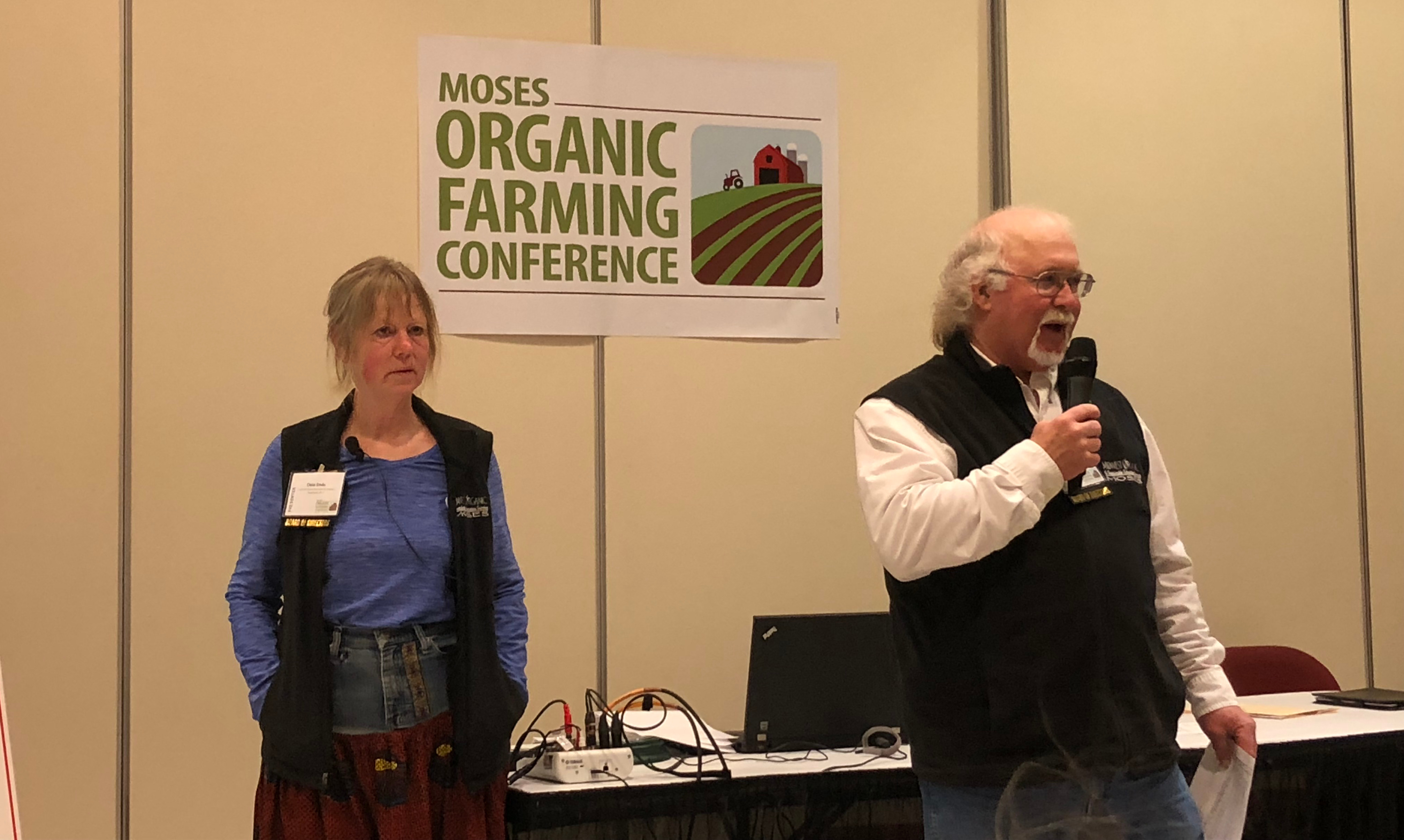 Organic farmers Dela Ends and Charlie Johnson at conference