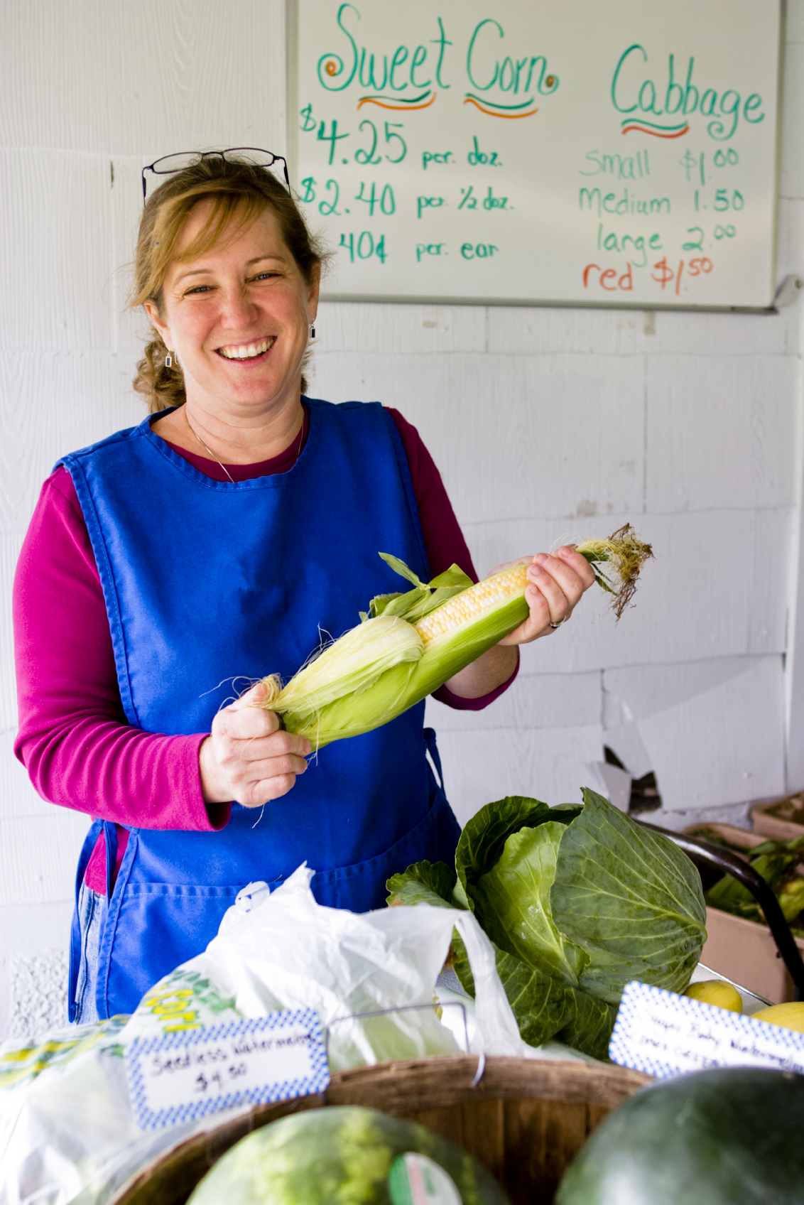 Woman at farmers market with corn