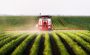 Photo of tractor spraying pesticides